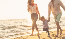 Photo: Family walking on the beach