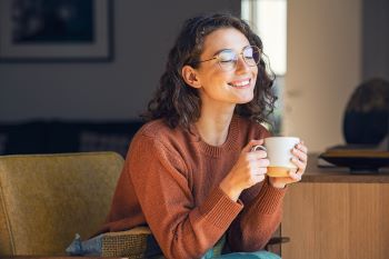 Photo: Woman Drinking a Cup of Coffee