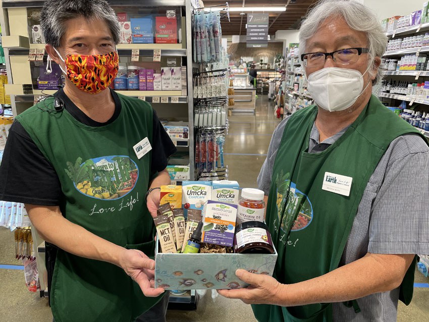 Photo: Down to Earth Kakaako Wellness Team Holding Giveaway Prize