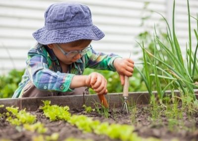 Photo: Child working in a garden