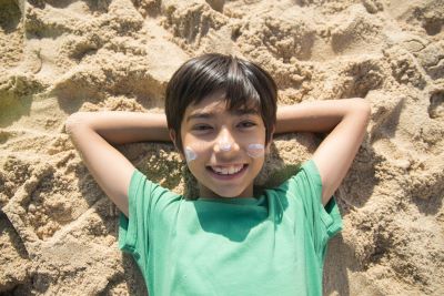 Kid Smiling on the Beach