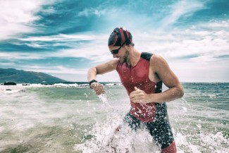 Photo: Triathlete Running out of the Ocean