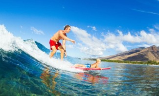 Photo: Father and son surfing