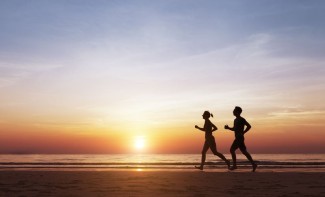 Photo: Silouette of Couple Running