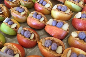 Photo: Sliced apples with candy, sliced almonds and peanut butter