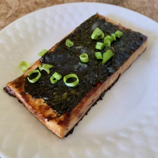 Photo: Sauteed tofu cutlet with nori sheet and green onions on top