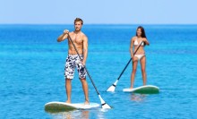 Photo: Man and Woman on Stand-Up Paddleboards
